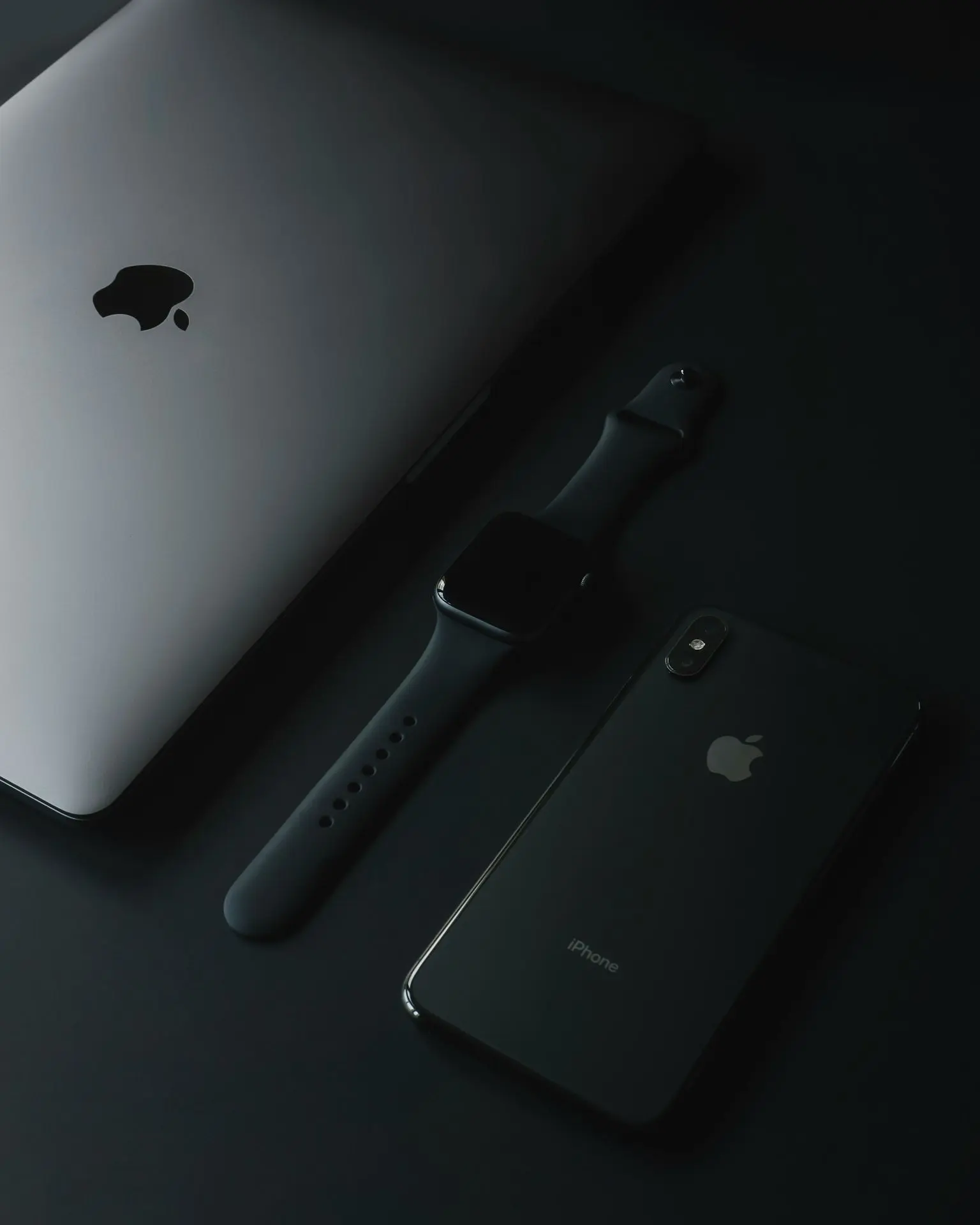 three assorted Apple products